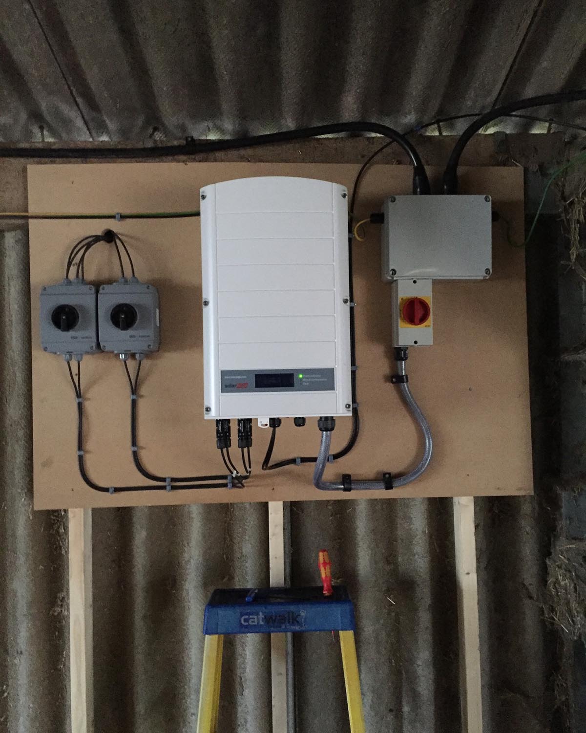 Boiler box connected to smaller boxes. NBG Digital Home. Electric Vehicle chargers, Solar and Heat Pumps, General Electrical Services in the South West.