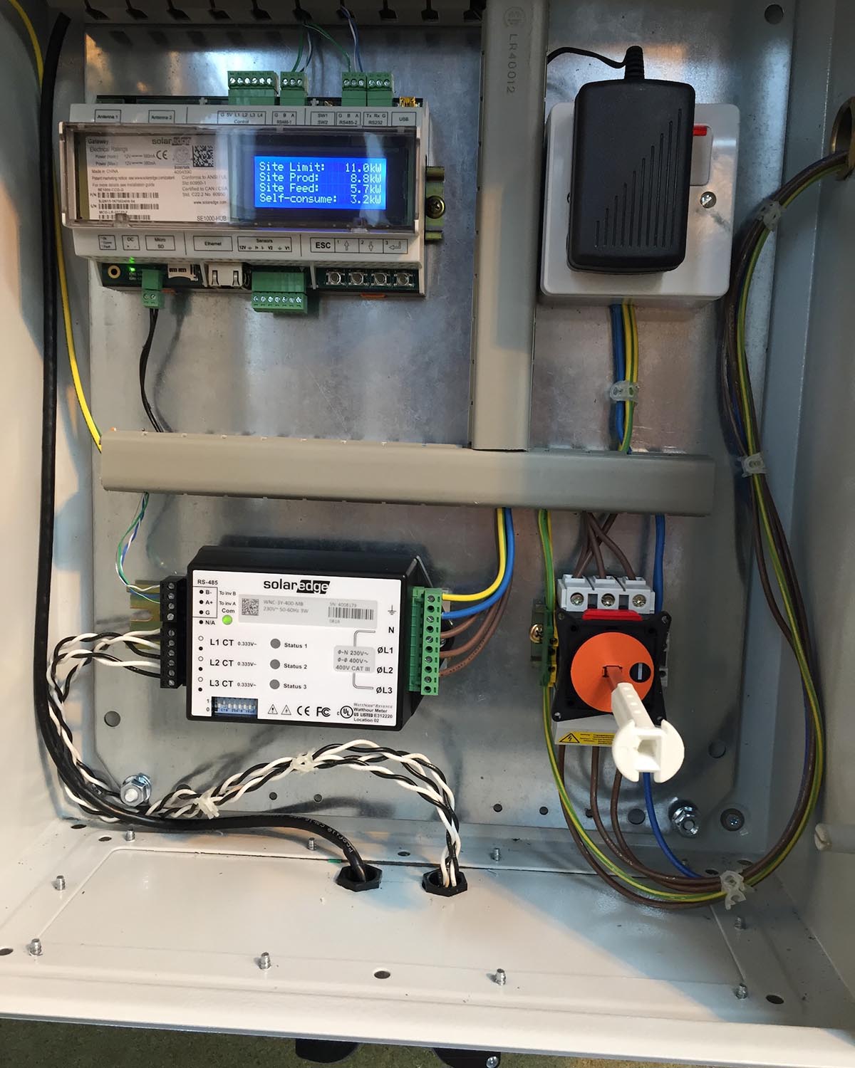 Control board with wires and display screen. NBG Digital Home. Electric Vehicle chargers, Solar and Heat Pumps, General Electrical Services in the South West.