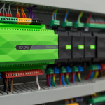 Green and black Loxone Mini server circuit board with coloured wires. NBG Digital Home. Electric Vehicle chargers, Solar and Heat Pumps, General Electrical Services in the South West.